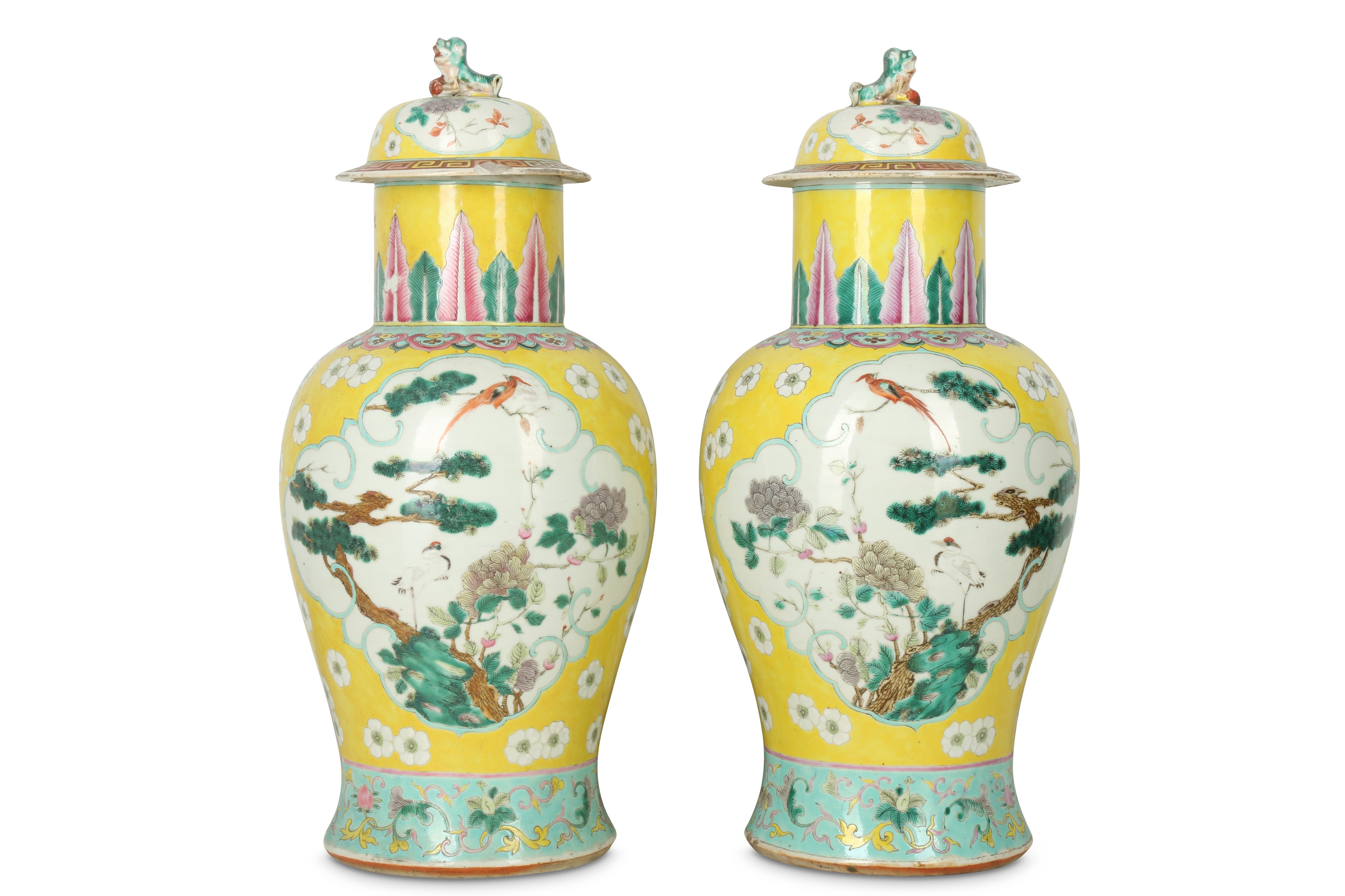 A PAIR OF CHINESE FAMILLE ROSE YELLOW-GROUND BALUSTER VASES AND COVERS.