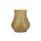 A SMALL CHINESE CREAM JADE ARCHAISTIC VASE.