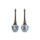 † A PAIR OF CHINESE BLUE AND WHITE SILVER-MOUNTED ROSE WATER SPRINKLERS.