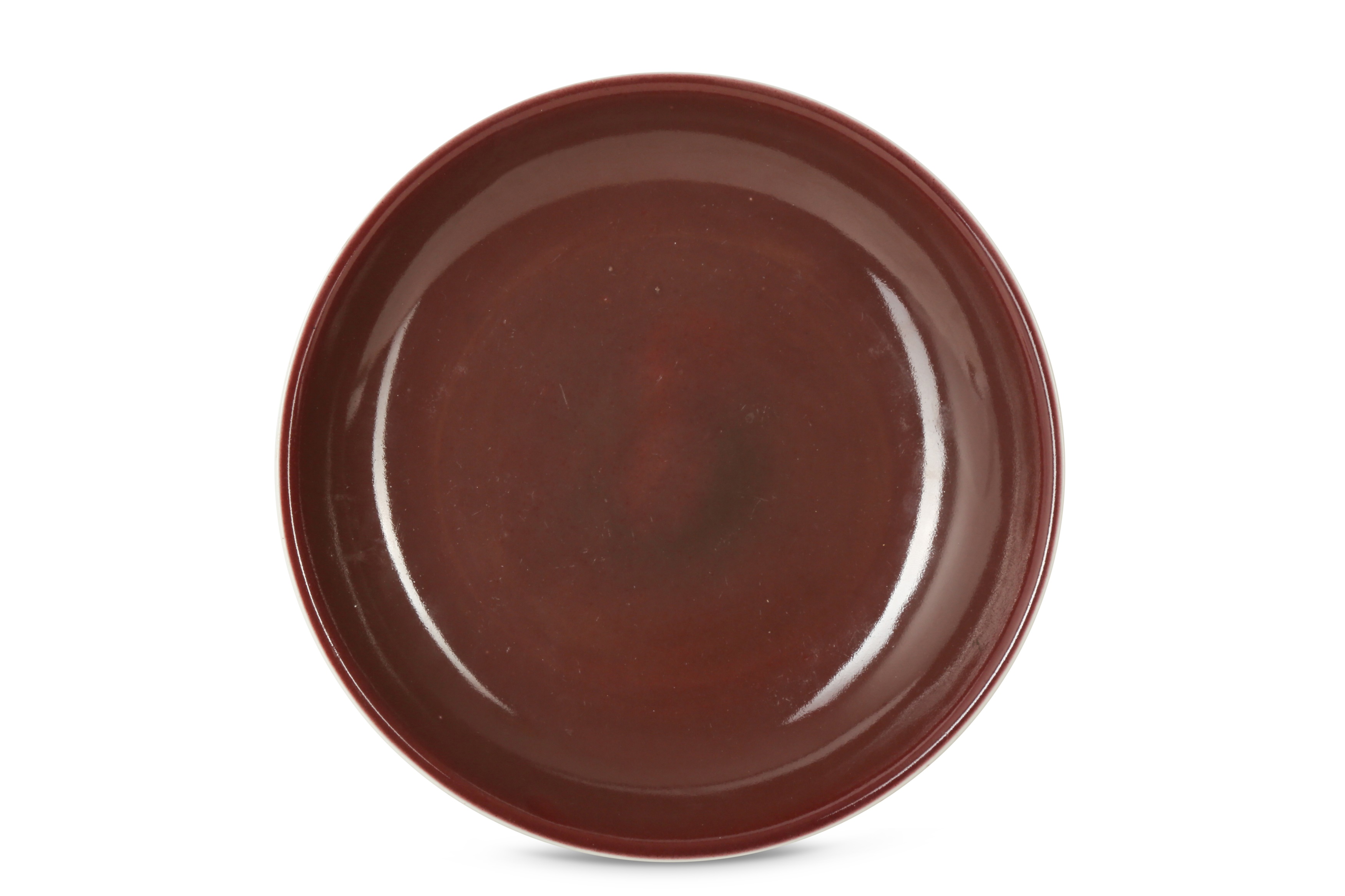 A CHINESE COPPER RED-GLAZED DISH.