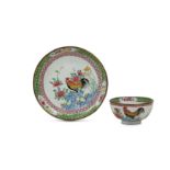 A CHINESE CANTON ENAMEL FAMILLE ROSE 'COCKERELS' CUP AND SAUCER.