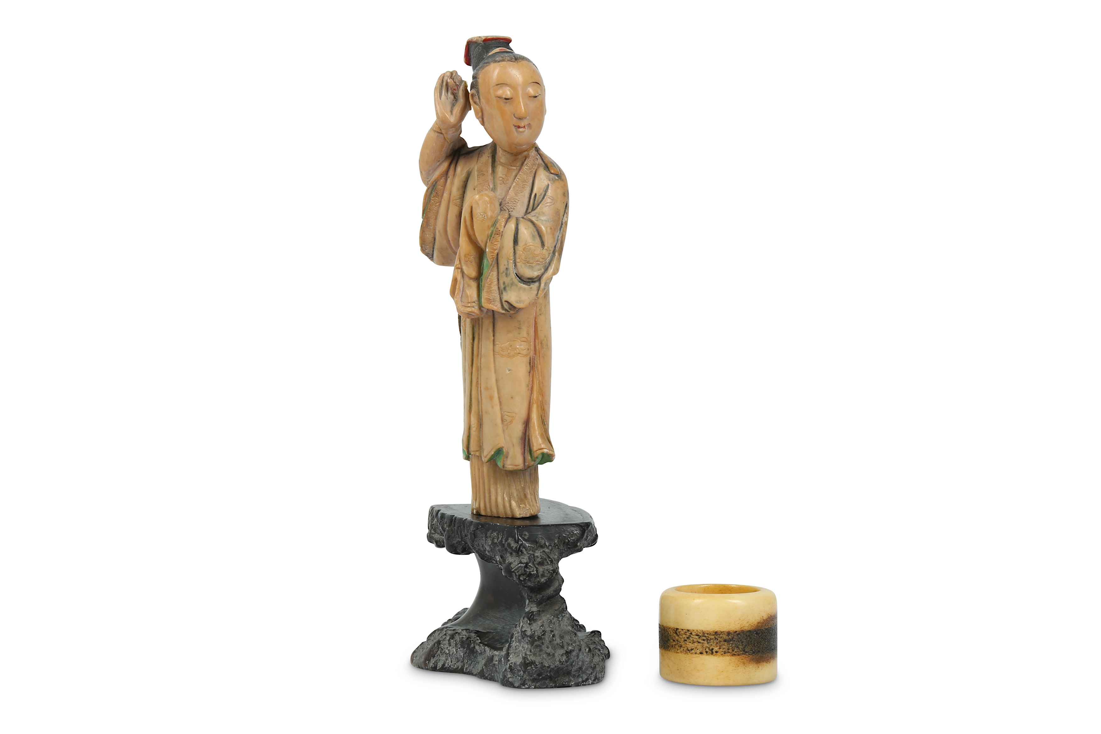 A SMALL CHINESE STAINED SOAPSTONE FIGURE TOGETHER WITH A DEER BONE ARCHER’S RING.