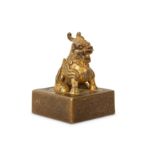 A CHINESE GILT-BRONZE SQUARE SEAL.