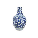 A CHINESE BLUE AND WHITE 'PRUNUS' BOTTLE VASE.