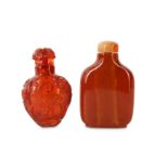 TWO CHINESE AMBER SNUFF BOTTLES.