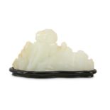 A CHINESE WHITE JADE 'MOUNTAIN' BRUSH REST.