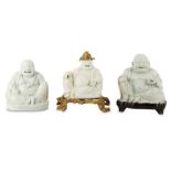 THREE CHINESE BLANC-DE-CHINE FIGURES OF BUDAI HESHANG.