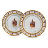 A PAIR OF CHINESE FAMILLE ROSE ARMORIAL DISHES.