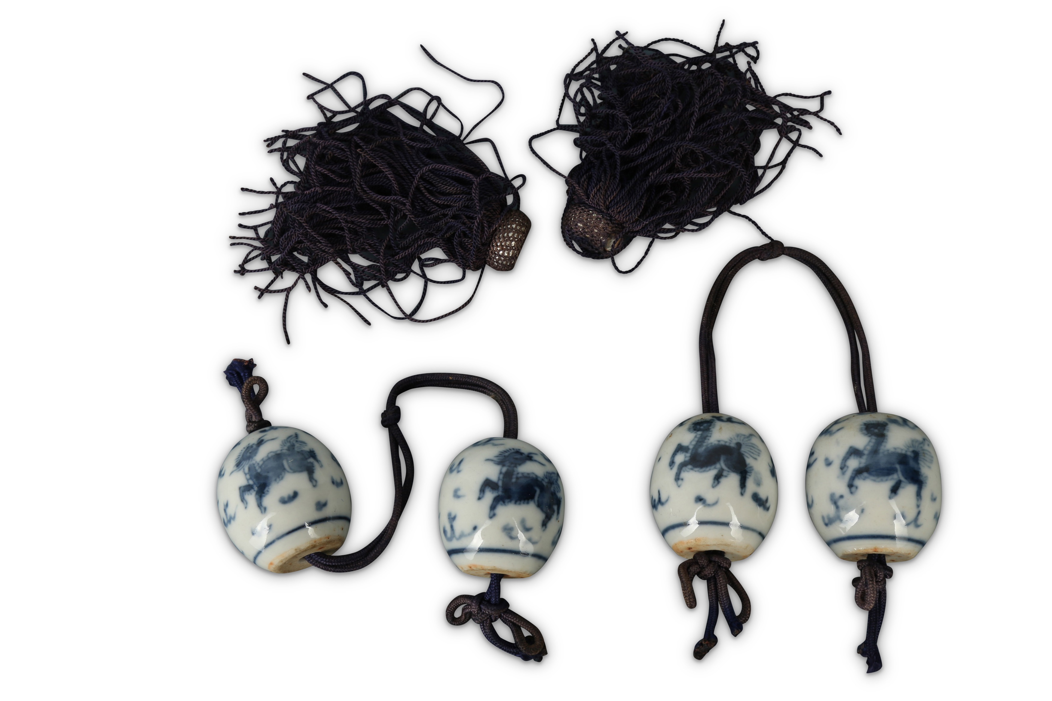 FOUR CHINESE BLUE AND WHITE SCROLL WEIGHTS.