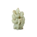 A CHINESE PALE CELADON JADE 'THREE BOYS' GROUP.