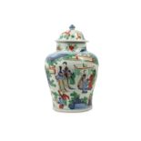 A CHINESE WUCAI 'LADIES AND BOYS' BALUSTER JAR AND COVER.