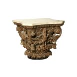 A CARVED WOODEN TABLE WITH MARBLE TOP