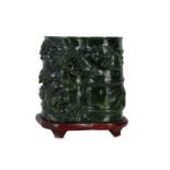 A Chinese spinach green jade double 'bamboo' vase.