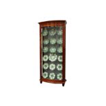 A pair of mahogany bow fronted glazed display cabinets