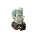 A Chinese apple-green jade cat group.