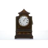 An Empire brass inlaid mantle clock