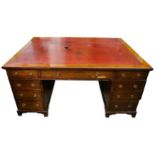 A late Victorian mahogany partners desk