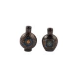Two Chinese mother of pearl inlaid black lacquer snuff bottles.