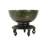 A large Chinese spinach jade 'longevity' bowl.