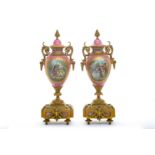 A pair of 19th century Sevres style pink porcelain and bronze mounted vases