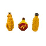 A collection of three Chinese yellow Peking glass snuff bottles.