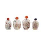 A collection of four Chinese inside-painted glass snuff bottles.