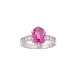 A pink sapphire and diamond ring