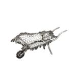 An Edwardian sterling silver novelty bon bon wheelbarrow, London 1908 by Goldsmiths and