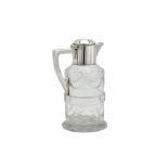 A George V sterling silver mounted glass claret jug, London 1914 by Goldsmiths and Silversmiths