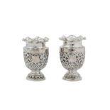 A pair of early 20th century Anglo – Indian Raj unmarked silver vases, Kutch circa 1900