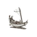 A second half of the 20th century Burmese unmarked silver model of an Irrawaddy rice boat