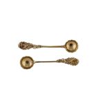 A pair of George II / George III unmarked silver gilt salt spoons, probably London circa 1760