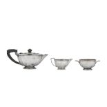 A George V Art Deco sterling silver three-piece tea service, Birmingham 1934 by Goldsmiths and