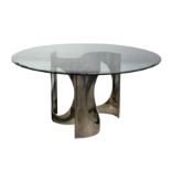 A 20th century circular glass dining table on chrome base