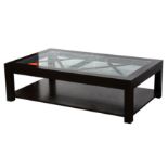 A contemporary black framed glass coffee table