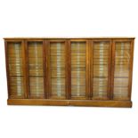 Baird & Tatlock (London) Ltd: An early 20th Century oak collectors cabinet