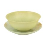 A celedon jade bowl and green hardstone circular dish