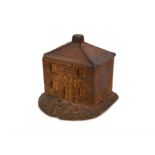 A 19/20th century stoneware money box in the form of a cottage