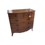 A mid 19th Century bow fronted flame mahogany chest