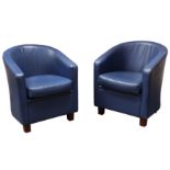 A pair of 20th Century blue leather upholstered tub chairs