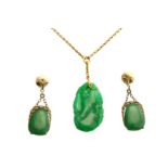 A jade pendant and a pair of jade earrings