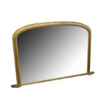 A Victorian rounded arch gilt overmantel mirror