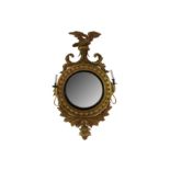 A Regency convex gilt wall mirror