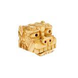 A Meiji period Japanese ivory lion dog (Shishi) netsuke