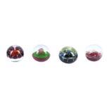 A set of four limited edition Caithness paperweights