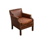 A contemporary brown leather club chair