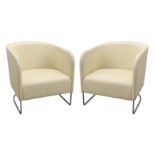 A pair of Danish tub chairs, upholstered in cream fabric