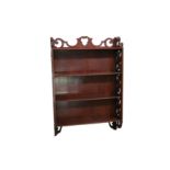 An early 20th Century Chippendale style set of mahogany hanging wall shelves
