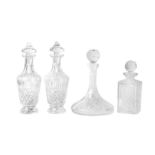 A collection of four glass decanters, including a pair of Irish Waterford