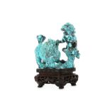 A CHINESE TURQUOISE ‘LION DOGS’ CARVING.